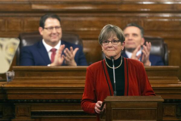 Gov. Laura Kelly is applauded as she begins addressing the Kansas Legislature for the annual State of the State, Tuesday, Jan. 11, 2022, in Topeka, Kan. (Evert Nelson/The Topeka Capital-Journal via AP)