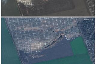 FILE - This combination of satellite images provided by Maxar Technologies shows the Staryi Krym cemetery in Mariupol, Ukraine, on March 29, 2022, top, and additional graves seen on Nov. 30, 2022. (Maxar Technologies via AP, File)