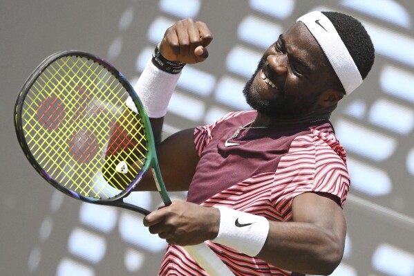 Frances Tiafoe, of the US, reacts during the quarterfinal match with Italy's Lorenzo Musetti at the ATP tour in Stuttgart, Germany, Friday, June 16, 2023. (Marijan Murat/dpa via AP)