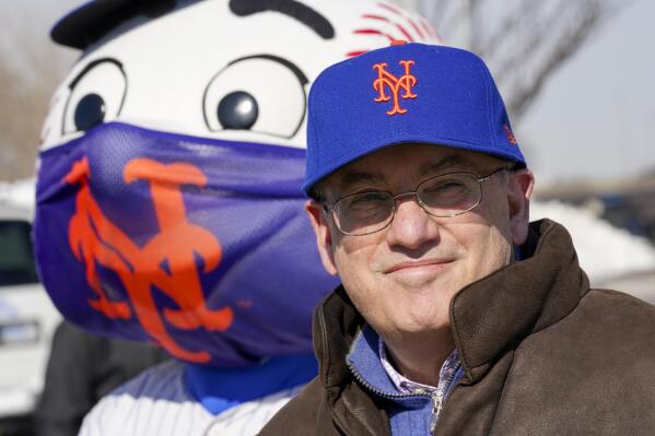 FILE - New York Mets owner Steve Cohen attends a news conference at a COVID-19 vaccination site at Citi Field, the home of the Mets, Feb. 10, 2021, in the Queens borough of New York. Cohen heard that baseball's new luxury tax level was named after him. “It’s better than a bridge being named after you,” the he said Sunday, March 13, 2022, as spring training camp opened after a 25-day delay caused by Major League Baseball's lockout. (AP Photo/Mary Altaffer, File)