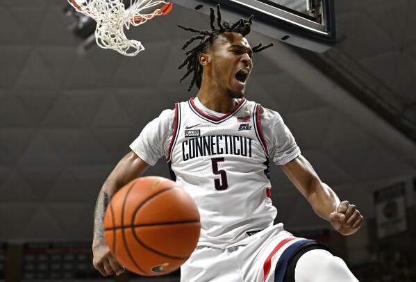 UConn guard Stephon Castle (5) reacts after dunking the ball in the first half of an NCAA college basketball game against Seton Hall, Sunday, March 3, 2024, in Storrs, Conn. (AP Photo/Jessica Hill)