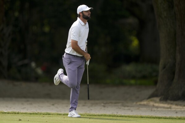 Scottie Scheffler hits from the fairway on the 15th hole during the third round of the RBC Heritage golf tournament, Saturday, April 20, 2024, in Hilton Head Island, S.C. (AP Photo/Chris Carlson)
