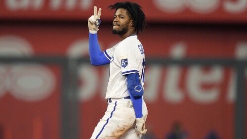 Kansas City Royals' Maikel Garcia celebrates on second after hitting a two-run double during the sixth inning of a baseball game against the Detroit Tigers Tuesday, July 18, 2023, in Kansas City, Mo. (AP Photo/Charlie Riedel)