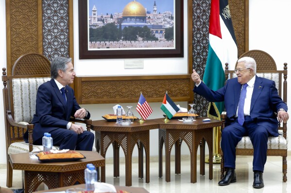 U.S. Secretary of State Antony Blinken, left, meets with Palestinian President Mahmoud Abbas, right, in Ramallah in the Israeli-occupied West Bank, Wednesday, Jan. 10, 2024, during his week-long trip aimed at calming tensions across the Middle East. (Evelyn Hockstein/Pool Photo via AP)