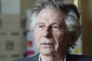 FILE - In this May 2, 2018 file photo, director Roman Polanski appears at an international film festival, where he promoted his latest film, "Based on a True Story," in Krakow, Poland. The entire leadership of the Cesar Awards, France's version of the Oscars, stepped down Thursday Feb. 13, 2020, in a spat over both its opaque decision-making process and controversial director Roman Polanski, whose new film, “An Officer and a Spy”, leads this year's nominations. (AP Photo, file)