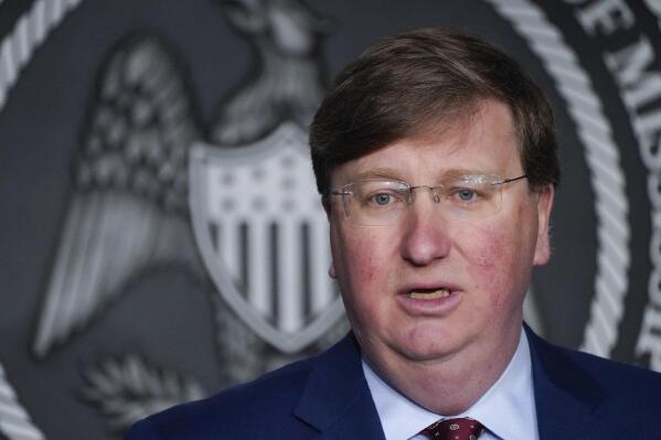 FILE - Mississippi Republican Gov. Tate Reeves speaks during a news conference on Feb. 28, 2023, in Jackson, Miss. Reeves signed a bill Tuesday, March 14, 2023, that will restrict electric car manufacturers from opening dealerships in the state unless they work with a franchisee, defying calls to veto the legislation from some lawmakers in his party. (AP Photo/Rogelio V. Solis, File)