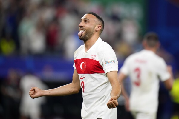  Turkey's Cenk Tosun celebrates after scoring his side's second goal during a Group F match between Czech Republic and Turkey at the Euro 2024 soccer tournament in Hamburg, Germany, Wednesday, June 26, 2024. (AP Photo/Petr David Josek)