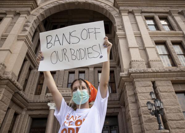 Jillian Dworin participates in a protest against the six-week abortion ban at the Capitol in Austin, Texas, on Wednesday, Sept. 1, 2021. Dozens of people protested the abortion restriction law that went into effect Wednesday. (Jay Janner/Austin American-Statesman via AP)
