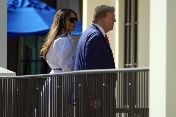 Republican presidential candidate former President Donald Trump and former first lady Melania Trump arrive to vote in the Florida primary election in Palm Beach, Fla., Tuesday, March 19, 2024. (AP Photo/Wilfredo Lee)