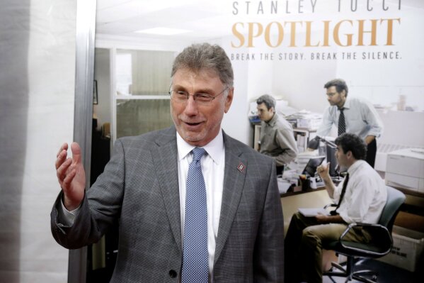 FILE - Marty Baron, former editor of The Boston Globe, walks the red carpet as he attends the Boston area premiere of the film "Spotlight"  in Brookline, Mass. on Oct. 28, 2015. Baron, executive editor of The Washington Post and one of the nation's top journalists, says he will retire at the end of February. He took over the Post's newsroom in 2012 after editing the Boston Globe and Miami Herald before that. He was portrayed in the 2015 movie “Spotlight” about the Globe's investigation of the Catholic Church. (AP Photo/Steven Senne, File)