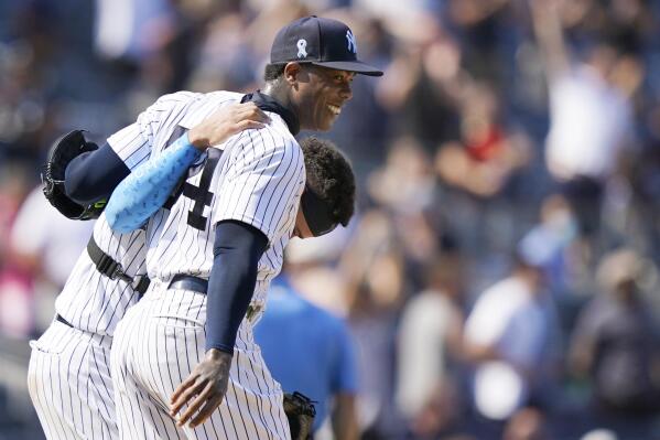 New York Yankees Rickey Henderson, left, greets Yankees relief