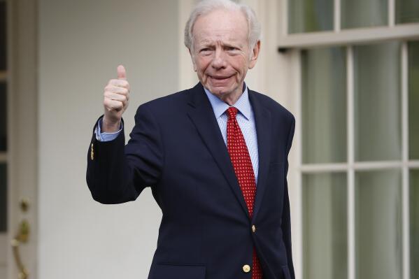 FILE - Former Connecticut Sen. Joe Lieberman gives a 'thumbs-up' as he leaves the West Wing of the White House in Washington, Wednesday, May 17, 2017. Lieberman details in a new book how aid from top Republicans helped him win reelection against a more left-leaning Democrat and a Republican. The Hartford Courant reported Monday, Oct. 18, 2021 that Lieberman provides new details in the book about help from Karl Rove, a top advisor to then-President George Bush. (AP Photo/Pablo Martinez Monsivais)