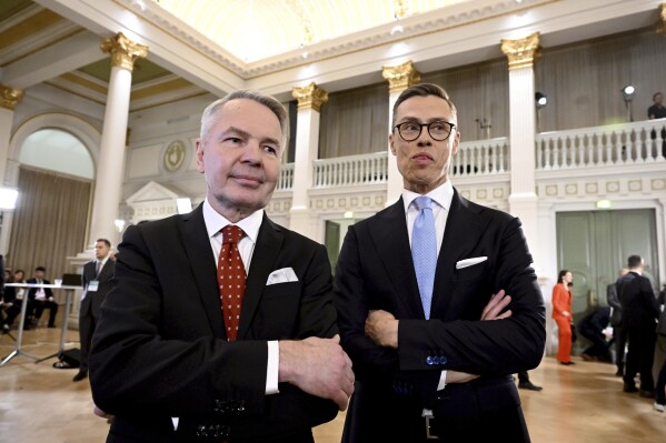 FILE - Leaders after the early vote results, National Coalition Party candidate Alexander Stubb, right, and Social Movement candidate Pekka Haavisto stand during the Presidential election event, at the Helsinki City Hall, in Helsinki, Finland, Sunday, Jan. 28, 2024. Finns on Sunday, Feb. 11, 2024 will pick a new head of state from the array of two experienced politicians whose main will be to steer the Nordic country’s foreign and security policy at an unprecedented time when the country is now a NATO member following Russia’s invasion of Ukraine, and its eastern border with Russia remains closed. (Markku Ulander/Lehtikuva via AP, File)
