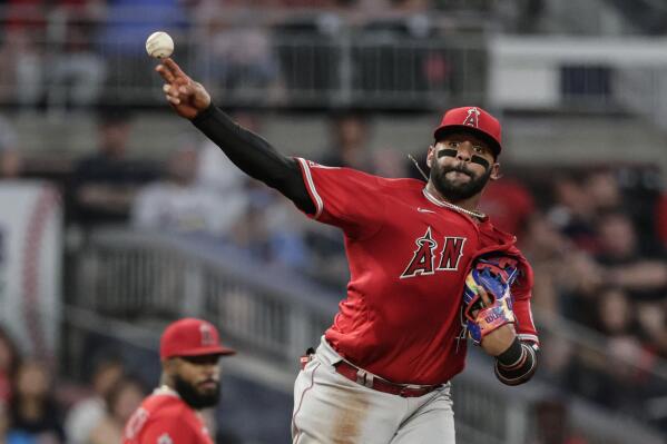 Dansby Swanson knocked out of game after errant throw to pitcher