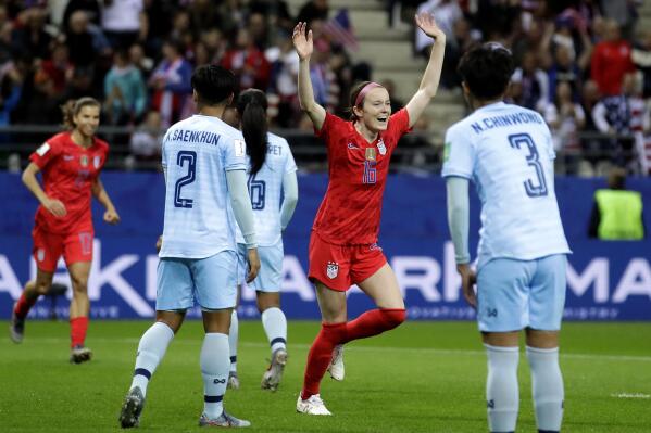 FILE - United States' Rose Lavelle, 2nd right, celebrates after scoring her side's 7th goal during the Women's World Cup Group F soccer match between United States and Thailand at the Stade Auguste-Delaune in Reims, France, June 11, 2019. The Thailand women's soccer team endured the biggest-ever loss at a women's soccer World Cup, in June 2019, a 13-0 trouncing by the United States which cast an unwelcome spotlight on the state of the sport in the South East Asian nation. Now a refurbished Thailand team under a new head coach and with the youngest playing group in its history has played Cameroon in an inter-continental playoff match in New Zealand, hoping to qualify again for a World Cup and move beyond the shadow of that defeat. (AP Photo/Alessandra Tarantino,File)