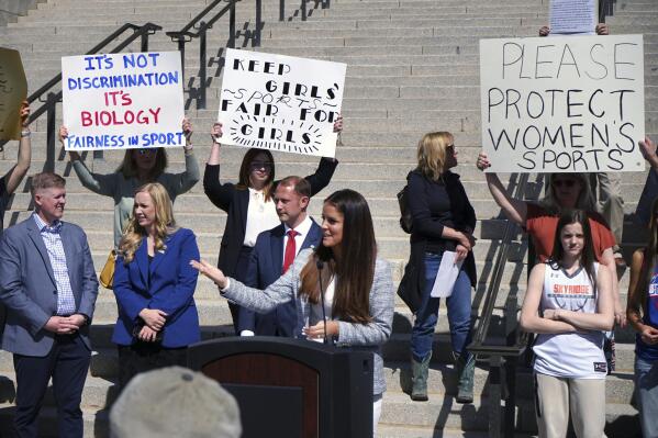 State Rep. Kera Birkeland, a Republican high school basketball coach who led Utah's efforts to ban transgender girls from youth sports, addresses a crowd of supporters on the steps of the Utah State Capitol on Friday, March 25, 2022, in Salt Lake City, Utah. Lawmakers convened to override Gov. Spencer Cox, who vetoed their proposed ban. (AP Photo/Samuel Metz)
