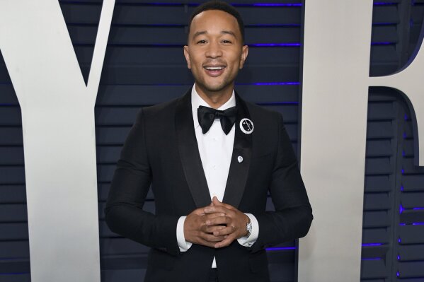 FILE - This Feb. 24, 2019 file photo shows John Legend at the Vanity Fair Oscar Party in Beverly Hills, Calif. People magazine has named Legend as the sexiest man alive in their special double issue on newsstands nationwide on Nov. 15. (Photo by Evan Agostini/Invision/AP, File)