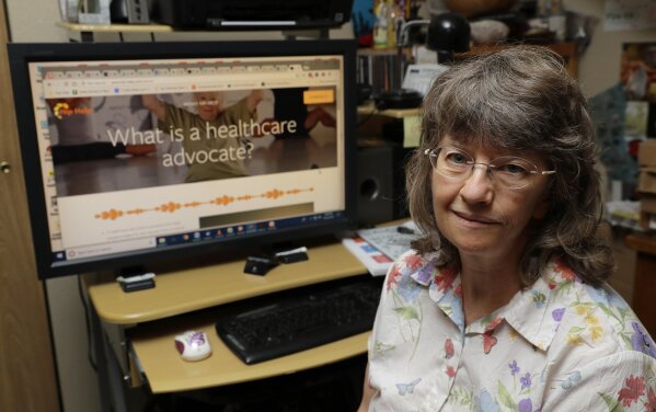 
              In this Aug. 22, 2018 photo, April Box poses for a photo at her home in Spokane, Wash. Box is a healthcare advocate and runs the website www.hip-help.com to help guide people through major surgeries and other aspects of the healthcare system.  Millions of people covered under the Affordable Care Act will see only modest premium increases next year, and some will get a price cut. That’s the conclusion from an exclusive analysis of the besieged but resilient program that still divides voters heading into this year's midterm elections.  (AP Photo/Ted S. Warren)
            