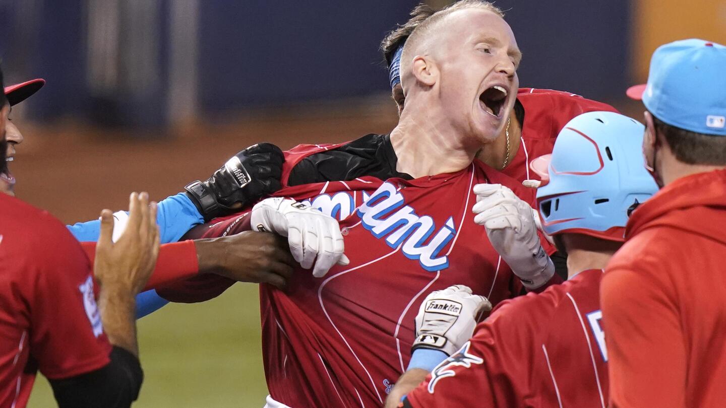 Marlins' Garrett Cooper reacts to his game-winning grand slam to sweep  Tigers 