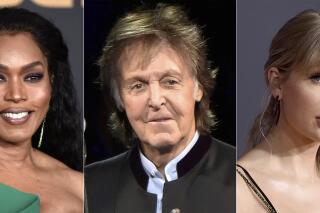 This combination of photos shows Angela Bassett at the 51st NAACP Image Awards in Pasadena, Calif., on  Feb. 22, 2020, from left, Paul McCartney during his One on One Tour in Tinley Park, Ill., on July 26, 2017,  and Taylor Swift at the American Music Awards in Los Angeles on Nov. 24, 2019. Bassett will induct singer Tina Turner into the Rock and Roll Hall of Fame during its annual ceremony, set for Cleveland on Oct. 30. McCartney will give the presentation for Foo Fighters and Swift will induct songwriter Carole King, and also perform some of her music, along with Jennifer Hudson. (AP Photo)