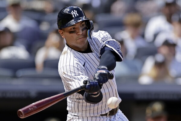 New York Yankees' Jose Trevino hits a two run-scoring single during the second inning of a baseball game against the Chicago White Sox, Sunday, May 19, 2024, in New York. (AP Photo/Adam Hunger)