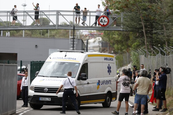 An ambulance carrying Italian rider Francesco Bagnaia arrives at the medical center after he was involved in a crash during the first lap of the race of the MotoGP Grand Prix at the Catalunya racetrack in Montmelo, just outside of Barcelona, Spain, Sunday, Sept. 3, 2023. (AP Photo/Joan Monfort)