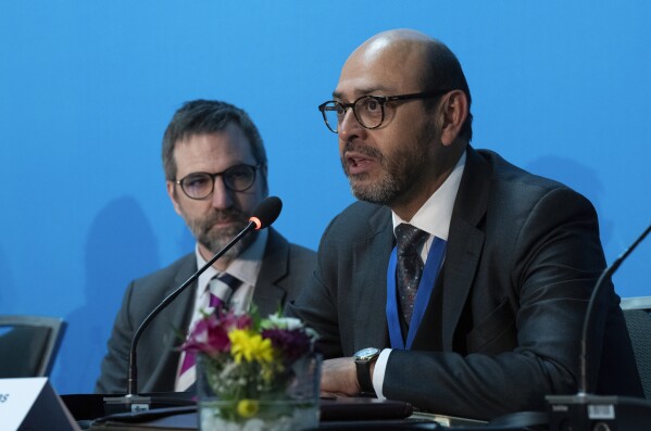 FILE - Environment and Climate Change Minister Stephen Guilbault is seen as chair of the intergovernmental negotiating committee Ambassador Luis Villas Valdivieso speaks during a news conference, April 23, 2024, in Ottawa, Ontario.  (Adrian Wilde/The Canadian Press via AP, File)