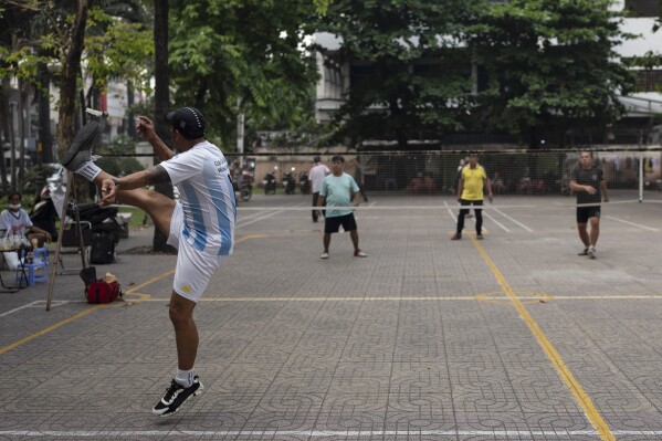 Residents play da cau at a park in Ho Chi Minh City, Vietnam, Jan. 13, 2024. Da cau is a recreational sport popular in Vietnam. (AP Photo/Jae C. Hong)