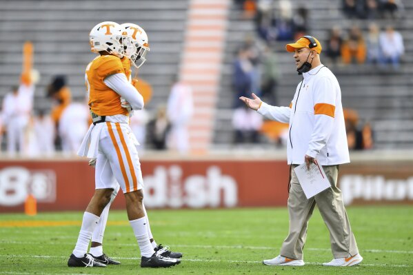 Tennessee head coach Jeremy Pruitt walks onto the field to talk to players during an NCAA college football game against Texas A&M  in Neyland Stadium in Knoxville, Tenn., Saturday, Dec. 19, 2020. (Brianna Paciorka/Knoxville News Sentinel via AP, Pool)
