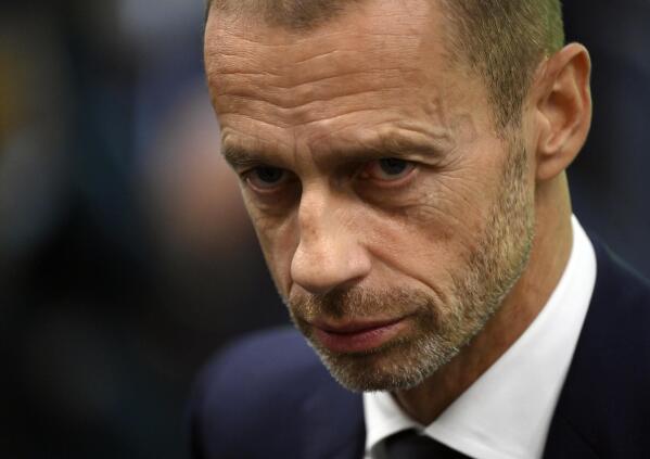 FILE - UEFA President Aleksander Ceferin at the UEFA Nations League semifinal soccer match between Italy and Spain at the San Siro Stadium, in Milan, Italy, Oct. 6, 2021. A group of top soccer clubs face Champions League organizer UEFA in court on Monday, July 11, 2022, for a legal match that risks the biggest upheaval in European soccer for more than 25 years. The Super League project failed at launch 15 months ago but the company formed by the 12 rebel clubs — now led by Real Madrid, Barcelona and Juventus — has brought a case to the Court of Justice of the European Union in Luxembourg. (Marco Bertorello/Pool via AP, File)