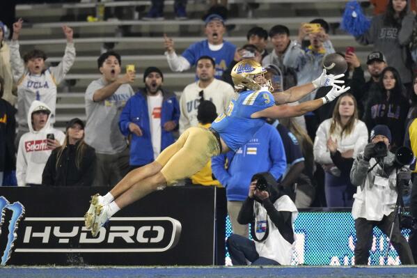 UCLA wide receiver Jake Bobo is unable to hold on to a ball thrown to the end zone with no time left in an NCAA college football game against Arizona Saturday, Nov. 12, 2022, in Pasadena, Calif. Arizona won 34-28. (AP Photo/Mark J. Terrill)