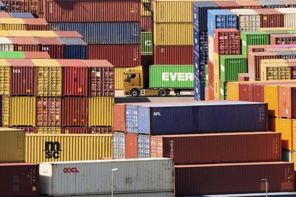 Containers are stored at a container terminal in Duisburg, Germany, the day after President Trump announced new tariffs for the EU and the rest of the world, Thursday, April 3, 2025. (AP Photo/Martin Meissner)