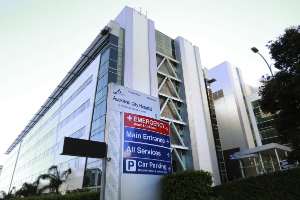 Signs are posted on the Exterior of Auckland City Hospital, May 13, 2017. New Zealand, Thursday, June 22, 2023, has been debating a thorny healthcare issue — whether ethnicity should be considered in deciding when patients get surgery. (Doug Sherring/New Zealand Herald via AP)