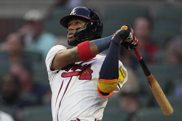 FILE - Atlanta Braves' Ronald Acuna Jr. watches his solo home run in the first inning of a baseball game against the Philadelphia Phillies Tuesday, Sept. 19, 2023. Atlanta's Ronald Acuña Jr. is favored to win the NL MVP award after becoming the first player with 40 home runs and 70 stolen bases in a season. (AP Photo/John Bazemore, File)