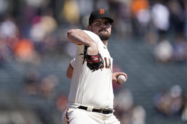San Francisco Giants' Carlos Rodón pitches against the Atlanta Braves during the first inning of a baseball game in San Francisco, Wednesday, Sept. 14, 2022. (AP Photo/Godofredo A. Vásquez)