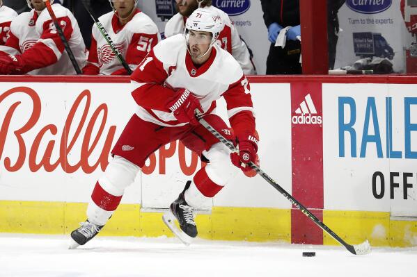 FILE - In this April 12, 2021, file photo, Detroit Red Wings' Dylan Larkin (71) moves the puck against the Carolina Hurricanes during the first period of an NHL hockey game in Raleigh, N.C. Larkin says he has never been this excited about the team during training camp. (AP Photo/Karl B DeBlaker, File)