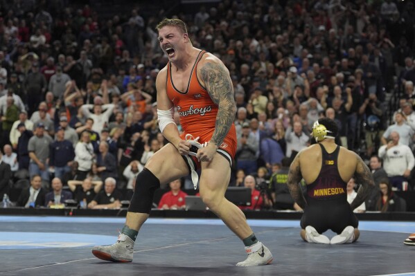 Oklahoma State's Wyatt Hendrickson reacts after defeating Minnesota's Gable Steveson during a 285-pound match in the finals at the NCAA wrestling championship, March 22, 2025, in Philadelphia. (AP Photo/Matt Rourke, file)
