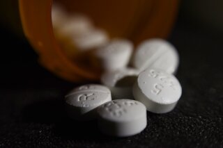 FILE - This Tuesday, Aug. 15, 2017 file photo shows an arrangement of pills of the opioid oxycodone-acetaminophen in New York. On Monday, Oct. 26, 2020, the American Academy of Pediatrics issued new guidance aimed at improving care for women and newborns affected by the mothers’ opioid use. (AP Photo/Patrick Sison)