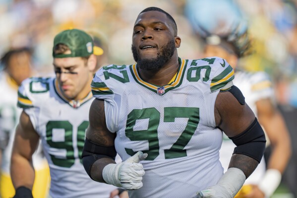 FILE - Green Bay Packers defensive tackle Kenny Clark (97) looks on during an NFL football game against the Carolina Panthers, Dec. 24, 2023, in Charlotte, N.C. Clark and the Green Bay Packers have agreed on a $64 million, three-year contract extension, a person familiar with the negotiations told The Associated Press on Sunday, July 21, 2024. (AP Photo/Jacob Kupferman, File)