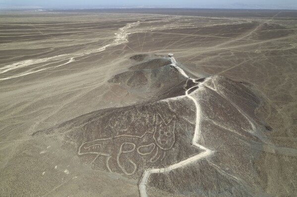 A cat-like Nazca Line geoglyph is visible from above in Nazca, Peru, May 17, 2023. (AP Photo/Martin Mejia, File)