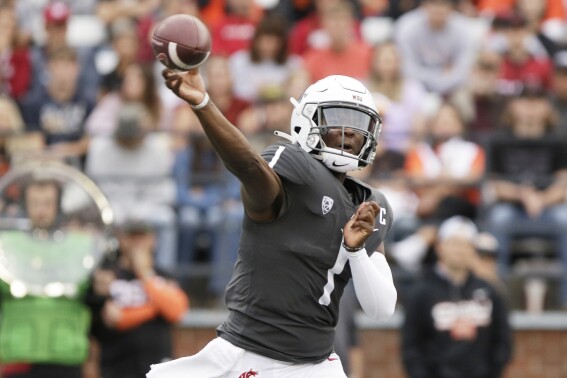 Washington State quarterback Cameron Ward throws a pass during the first half of an NCAA college football game against Oregon State, Saturday, Sept. 23, 2023, in Pullman, Wash. (AP Photo/Young Kwak)