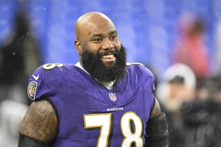 FILE - Baltimore Ravens offensive tackle Morgan Moses (78) looks on during warmups before an NFL football game against the Pittsburgh Steelers, Saturday, Jan. 6, 2024, in Baltimore. The New York Jets are acquiring offensive tackle Morgan Moses from the Baltimore Ravens in a trade that incudes draft picks for both teams, a person familiar with the deal told The Associated Press. The move Wednesday, March 13, 2024, reunites Moses with the Jets after he spent the 2021 season with New York.(AP Photo/Terrance Williams, File)