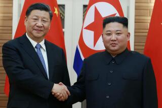 FILE - In this June 20, 2019, file photo provided by the North Korean government, North Korean leader Kim Jong Un, right, poses with Chinese President Xi Jinping for a photo at Kumsusan guest house in Pyongyang, North Korea. The North Korean and Chinese leaders expressed their desire Sunday, July 11, 2021 to further strengthen their ties as they exchanged messages marking the 60th anniversary of their countries’ defense treaty. In a message to Xi, Kim said it is “the fixed stand" of his government to “ceaselessly develop the friendly and cooperative relations" between the countries, the official Korean Central News Agency said. (Korean Central News Agency/Korea News Service via AP, File)