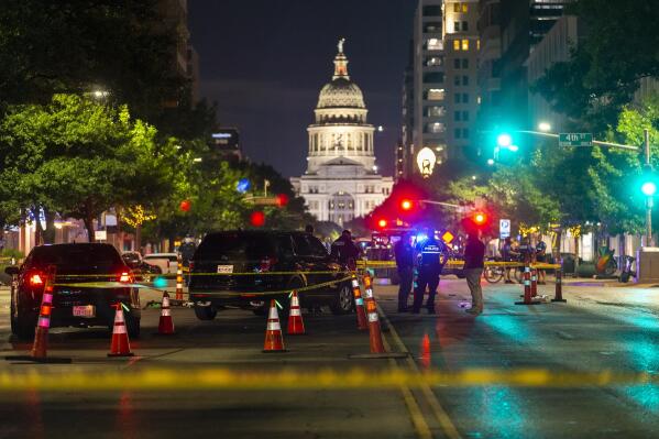 FILE - Austin police investigate a homicide shooting that occurred at a demonstration against police violence in downtown Austin, Texas, July 25, 2020. A U.S. Army sergeant was convicted of murder for fatally shooting an armed protester in 2020 during nationwide protests against police violence and racial injustice, a Texas jury ruled Friday, April 7, 2023. Sgt. Daniel Perry was working for a ride-sharing company in July 2020 when he turned onto a street and into a large crowd of demonstrators in downtown Austin. (Stephen Spillman/Austin American-Statesman via AP, File)