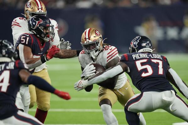 San Francisco 49ers running back Trey Sermon (28) runs against Houston Texans linebacker Kevin Pierre-Louis (57) during the first half of an NFL football game Thursday, Aug. 25, 2022, in Houston. (AP Photo/David J. Phillip)