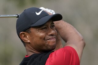 Tiger Woods of the United States watches his tee shot on the 2nd hole during the final round of the Zozo Championship PGA Tour at the Accordia Golf Narashino country club in Inzai, east of Tokyo, Japan, Sunday, Oct. 27, 2019. (AP Photo/Lee Jin-man)