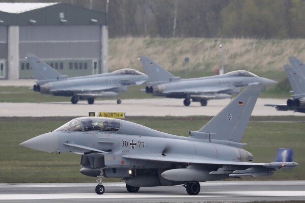 FILE - A Eurofighter from the German Air Force Weapons School takes off for an exercise in Large, Germany, Friday, April 30, 2021. The German government has approved the export of air-defense missiles to Saudi Arabia, underlining a softening of its hard line of recent years toward arms exports to the kingdom. News of the approval comes after the foreign minister said on Sunday that Germany is open to delivering more Eurofighter jets, made by a multinational consortium in which Berlin is involved, to Saudi Arabia. (Bernd Wuestneck/dpa via AP, File)