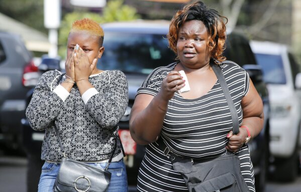 
              Women react after learning of a family member killed during a recent terrorist attack Wednesday, Jan. 16 2019, at the Chiromo Mortuary, Nairobi, Kenya. An upscale hotel complex in Kenya's capital came under attack on Tuesday, with a blast and heavy gunfire. The al-Shabab extremist group based in neighboring Somalia claimed responsibility and said its members were still fighting inside (AP Photo/Brian Inganga)
            