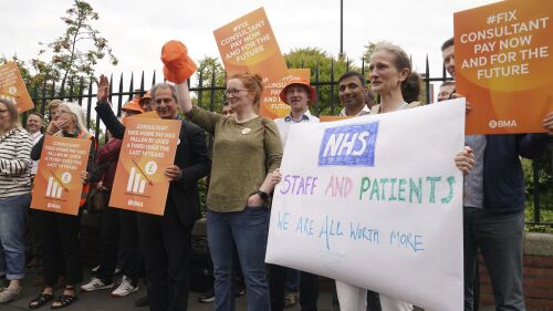 Medical consultant members of the British Medical Association (BMA) on the picket line outside the Royal Victoria Infirmary, Newcastle upon Tyne, as consultants in England are taking industrial action for the first time in more than a decade, Thursday July 20, 2023. (Owen Humphreys/PA via AP)