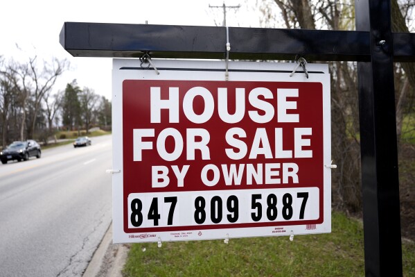 A for sale is displayed in front of home in Prospect Heights, Ill., Monday, March 18, 2024. On Thursday, March 28, 2024, Freddie Mac issues its weekly report on long-term U.S. mortgage rates. (AP Photo/Nam Y. Huh)